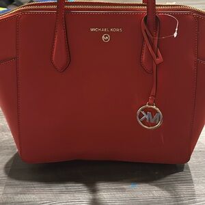 Like new with tags never worn Michael Kors red tote with matching change purse